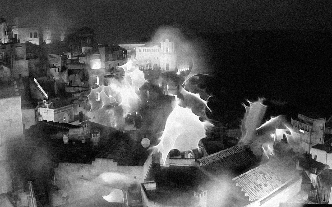 33. kép: A webkamera frontlencséjét esőcseppek borítják. A kamera egyébként a város jól ismert paleolitikum óta lakott ősi barlanglakásai felé van irányítva. Sassi, Matera tartomány.