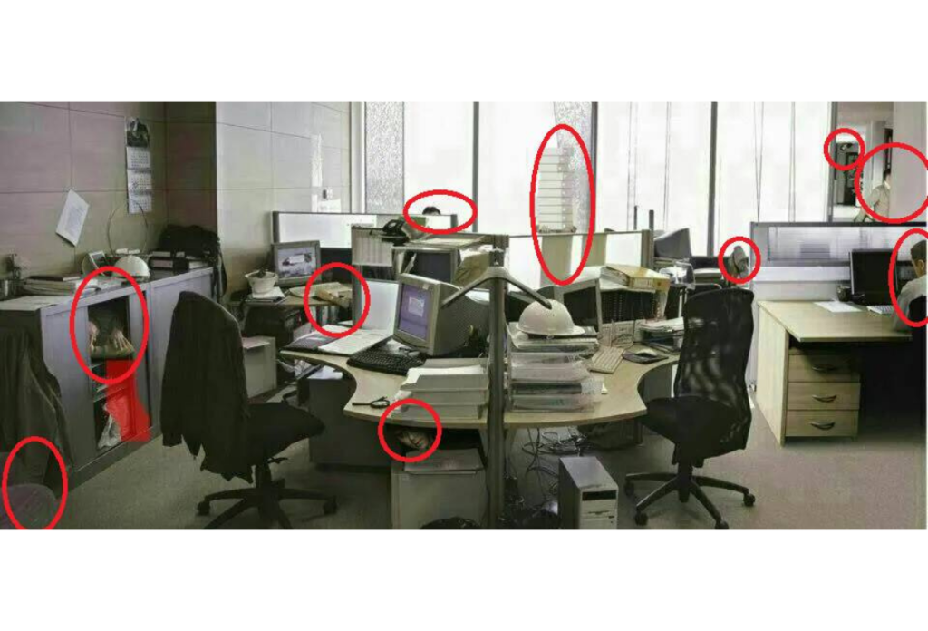 A piros karikák mutatják, hol rejtőzik ember az üresnek tűnő irodát ábrázoló fejtörőn.
