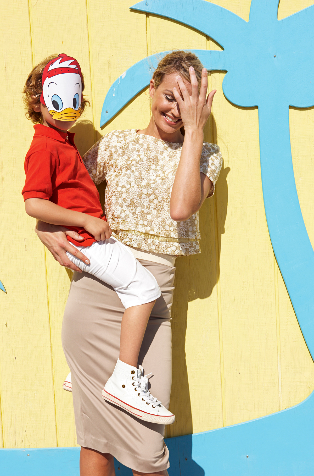 Seasons_10219881_HiRes_Son_wearing_disney_mask_being_carried_by_mother_mother_stroking_hair_from_face_smiling | Marie Claire