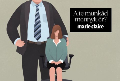 Üzletasszony ül egy irodai székben egy öltönyös, hatalmas férfi mellett