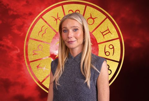 Gwyneth Paltrow szürke szövet felsőben, háttérben piros égbolt és arany színű körben a csillagjegyek szimbólumai