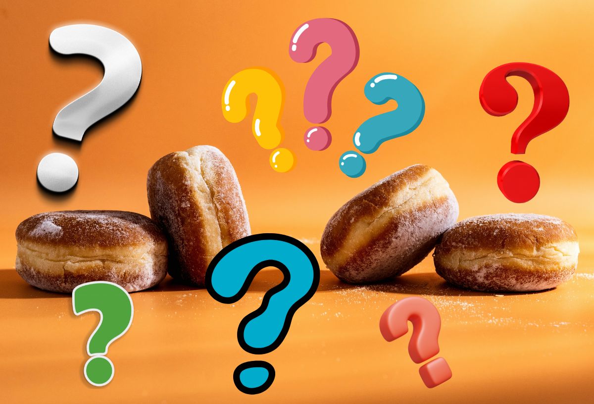 Narancsszínű háttér, négy szalagos fánk, mindenféle színű és alakú kérdőjelek