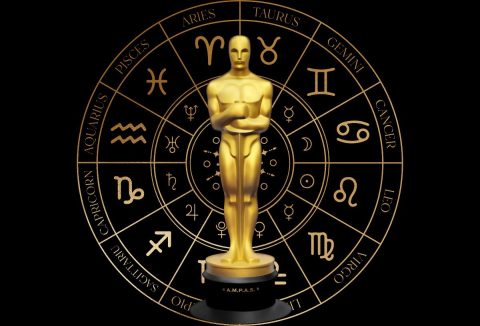 Oscar-díj fekete háttéren, mögötte csillagjegyek arany színű körben