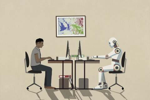 Egy ember és egy robot a laptop előtt