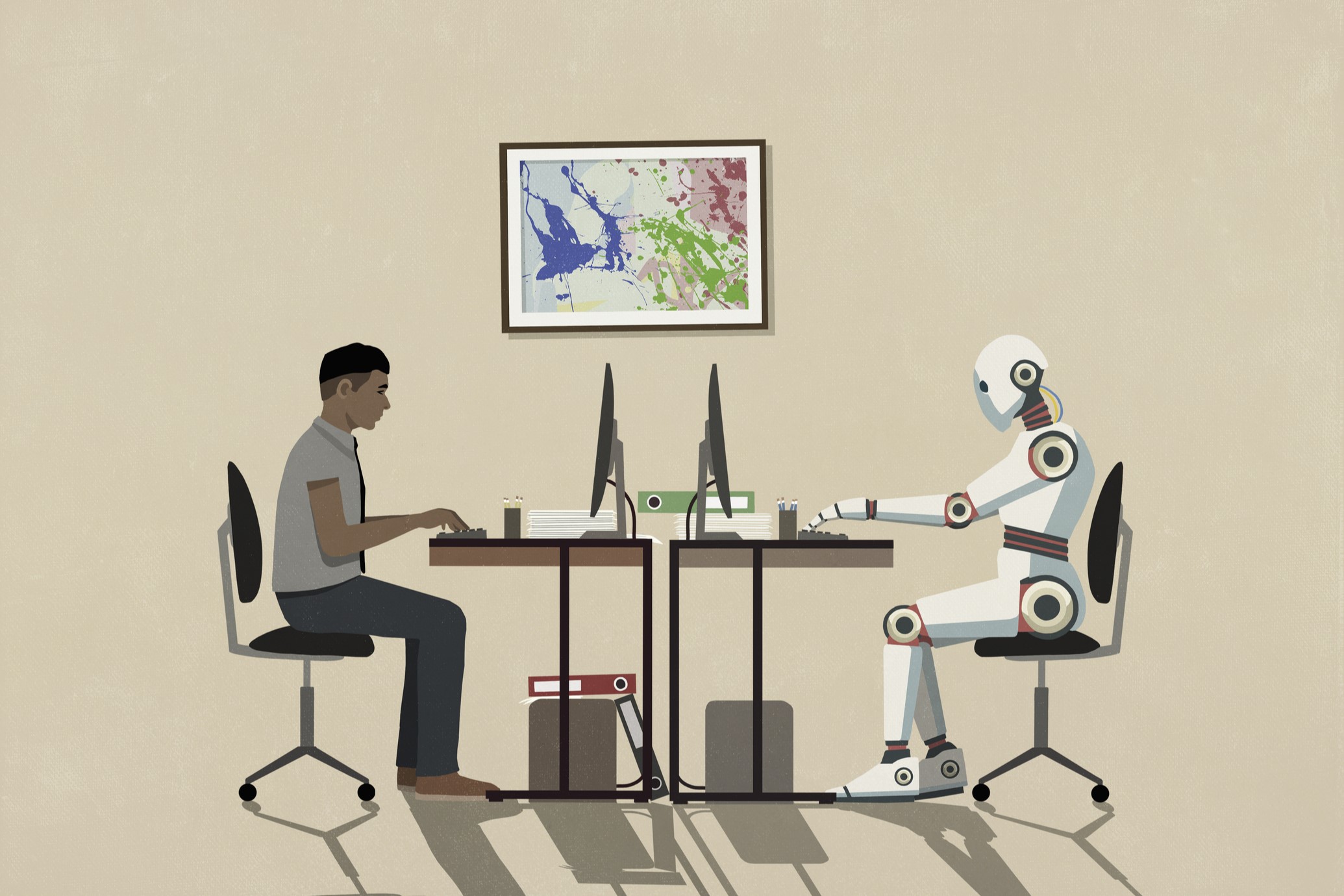 Egy ember és egy robot a laptop előtt