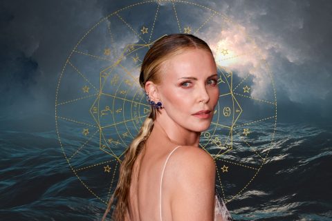 Charlize Theron viharos tengerrel a háttérben, arany zodiákus kör
