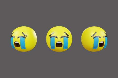 Három sírós arc emoji szürke háttéren